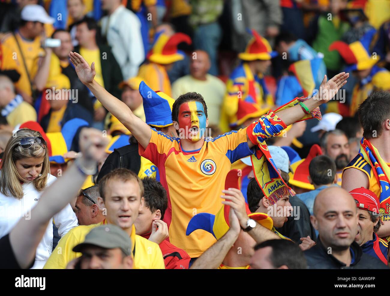 Romanian fans celebrate in the stands after the final whistle Stock Photo