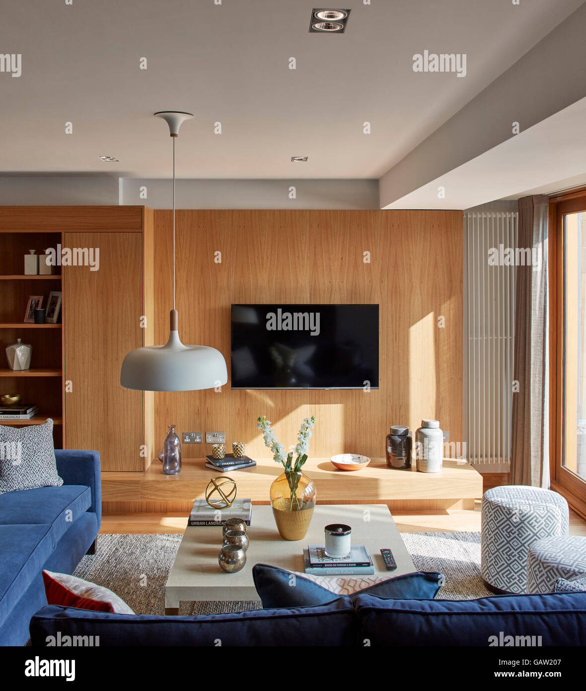 Interior view showing wooden panelled wall. Apartment in Crown Reach, London, United Kingdom. Architect: Burwell Deakins Architects, 2016. Stock Photo