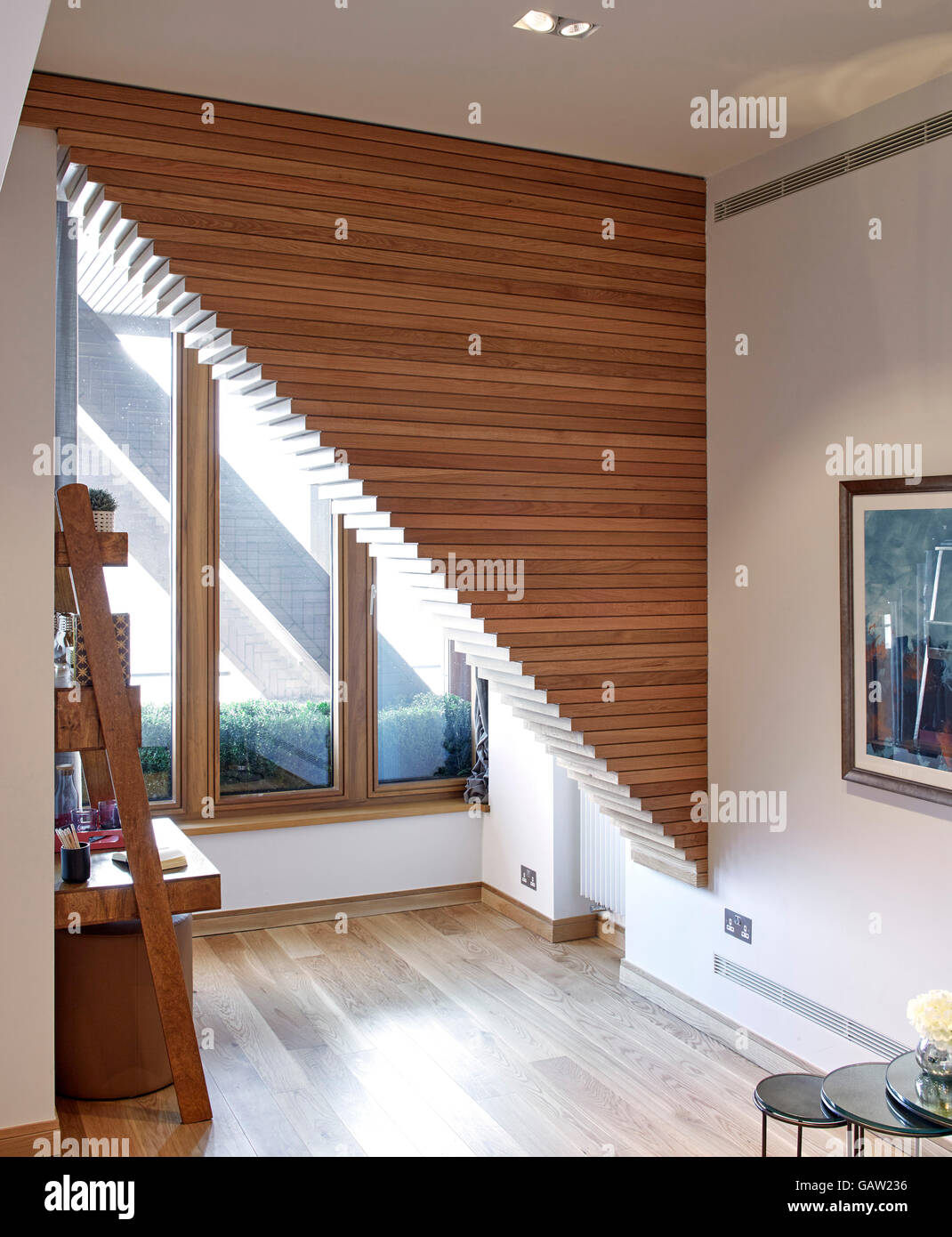 Living room with structural support beams. Apartment in Crown Reach, London, United Kingdom. Architect: Burwell Deakins Architects, 2016. Stock Photo