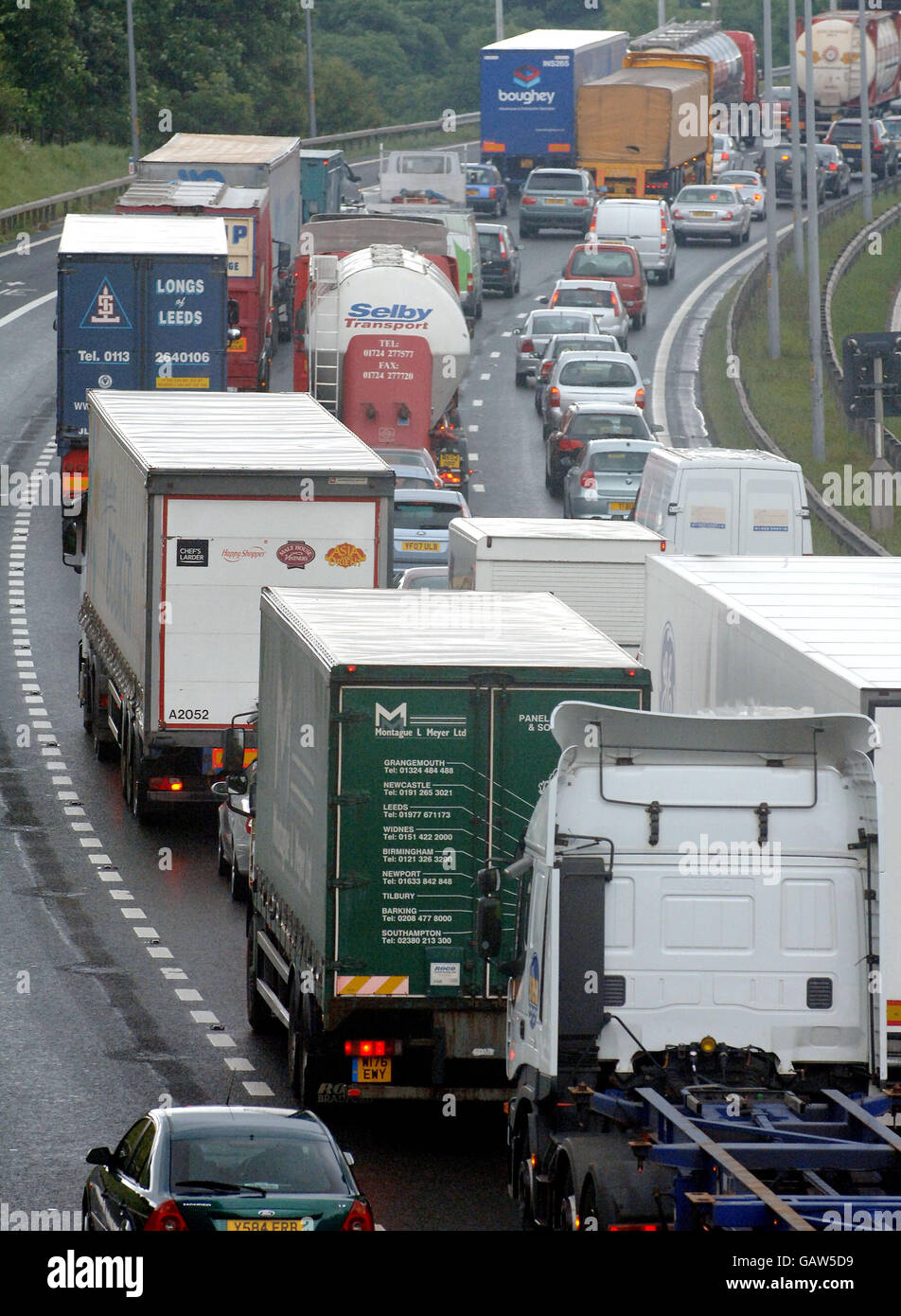 Truckers form a convoy along the M62 in West Yorkshire to protest against high fuel prices. Stock Photo