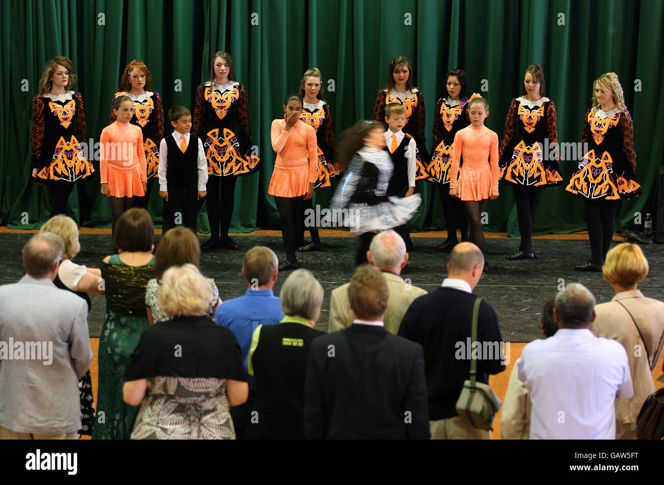 Traditional Irish dancing in the main foyer, during Irish Day at Sandown Park Racecourse. Stock Photo