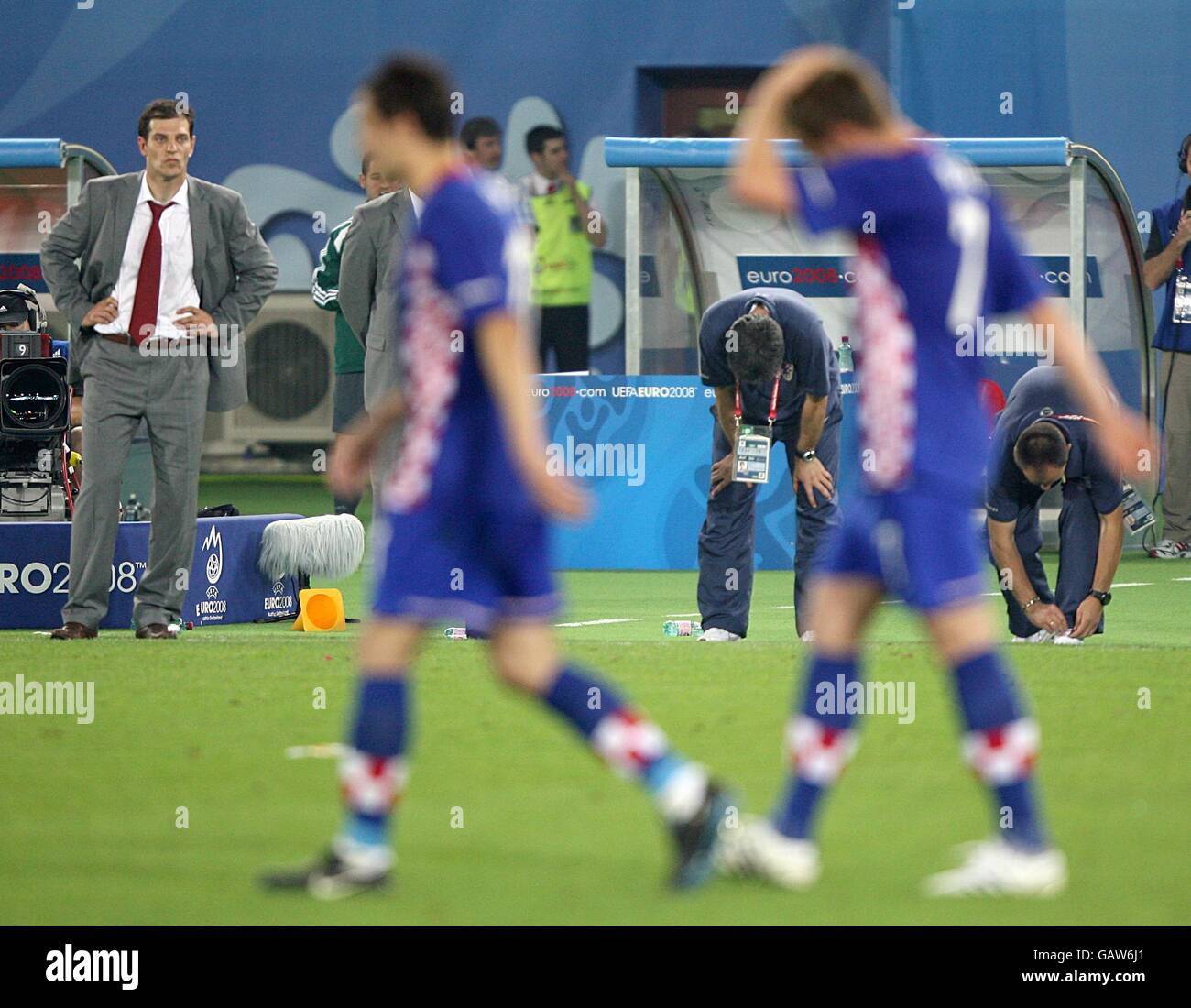 Croatia coach Slaven Bilic (l) watches from the touchline as Ivan Rakitic (r) is left dejected after missing a penalty for his side Stock Photo