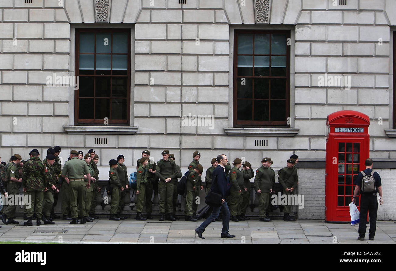 Territorial Army soldiers line up on Parliament Square, London, as they wait to attend a pageant to celebrate 100 years of the territorial army. Stock Photo