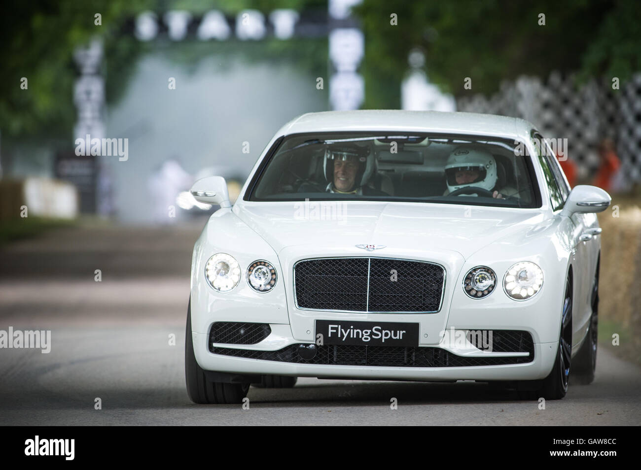 A Bentley Flying Spur drives up the hill during the Super Car Run at the Goodwood Festival of Speed 2016 Stock Photo