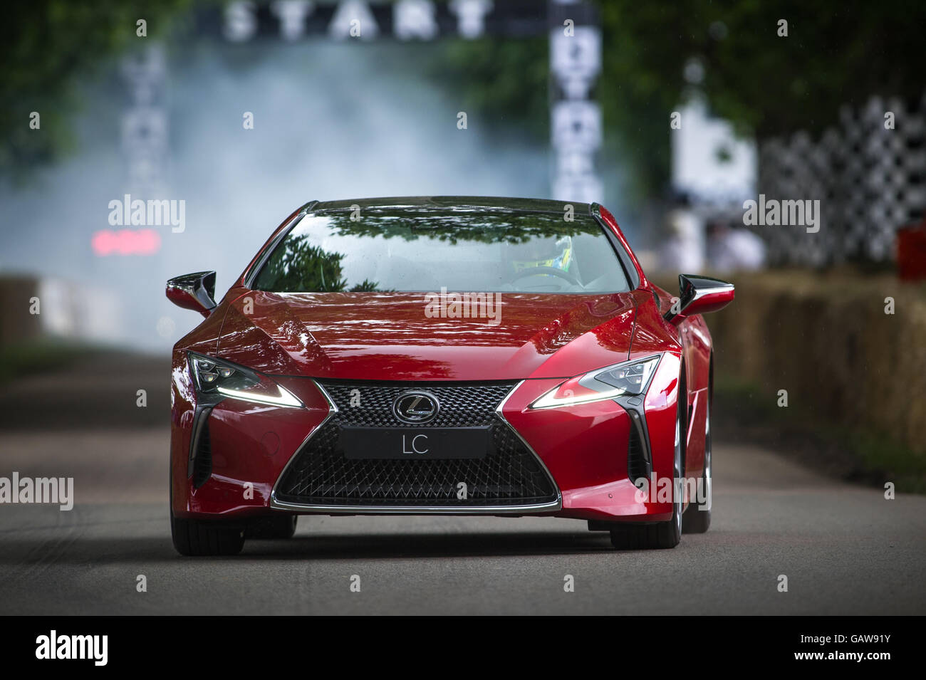 A Lexus LC500 drives up the hill during the Super Car Run at the Goodwood Festival of Speed 2016 Stock Photo
