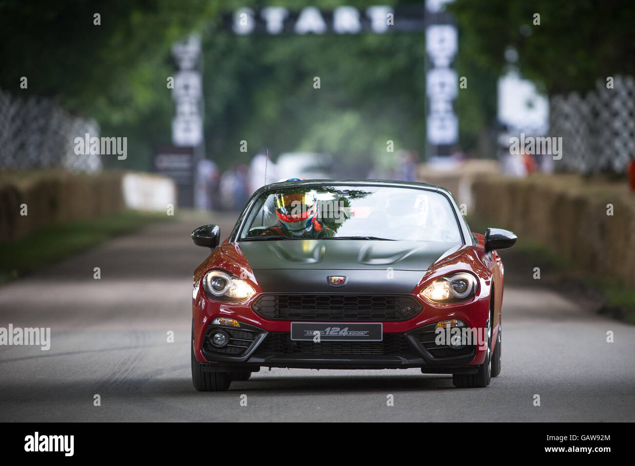 A Fiat Abarth 124 Spider drives up the hill during the Super Car Run at the Goodwood Festival of Speed 2016 Stock Photo