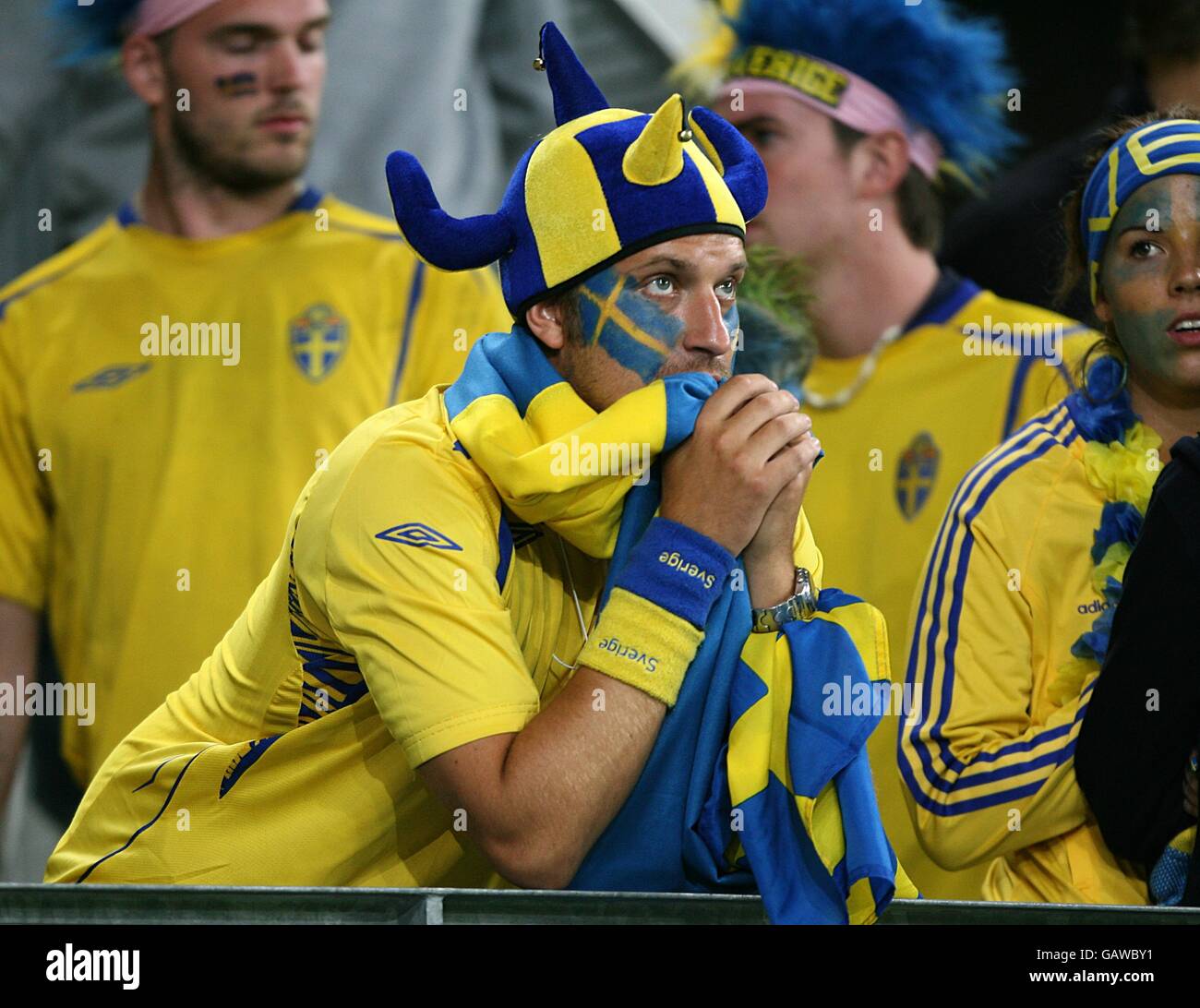 Soccer - UEFA European Championship 2008 - Group D - Russia v Sweden - Tivoli Neu Stadium. Swedish fans look dejected, in the stands after the final whistle. Stock Photo