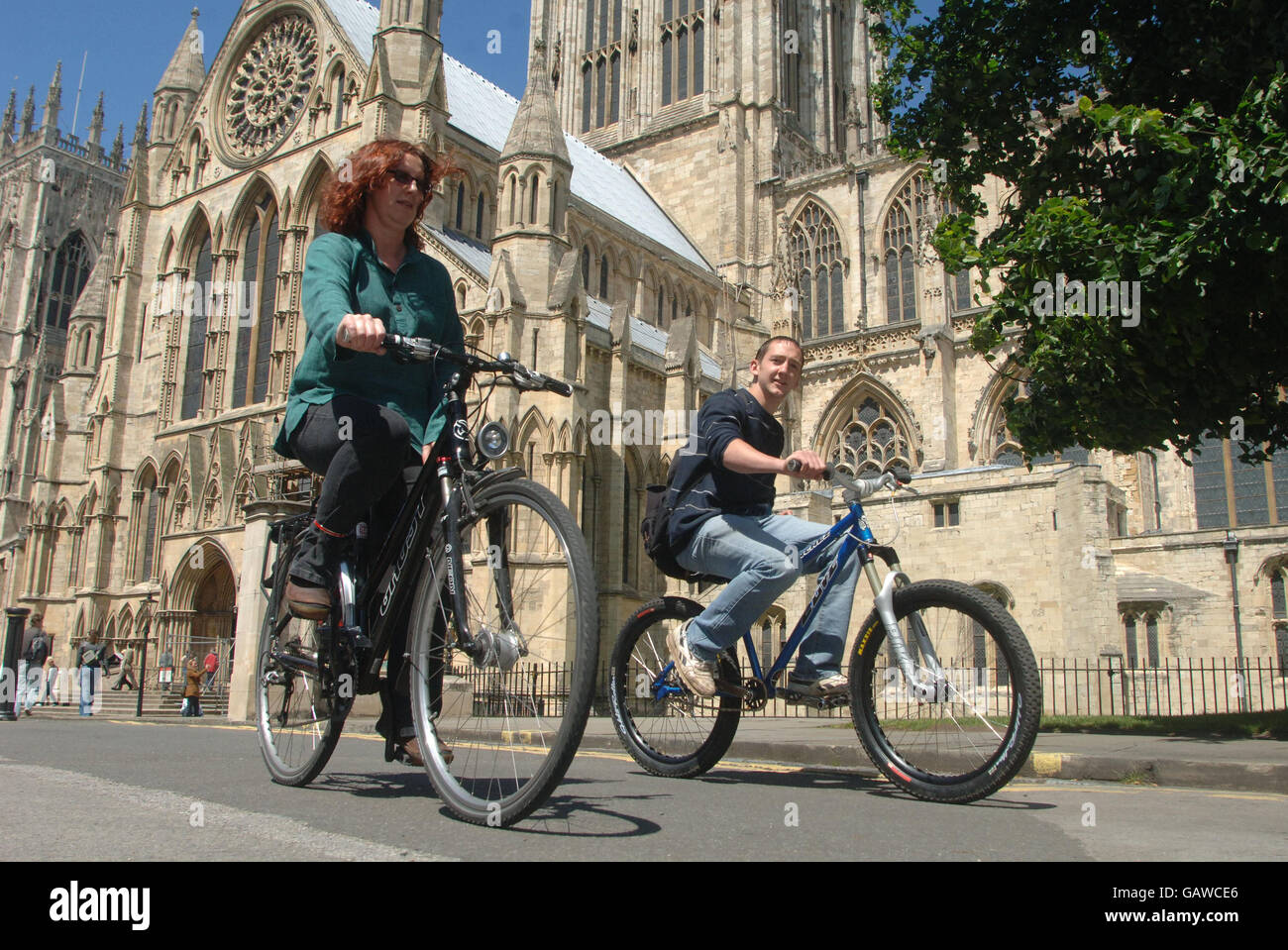 Cyclists use the cycle path next to York Minster in York city centre, one of the areas designated to promote cycling. Stock Photo