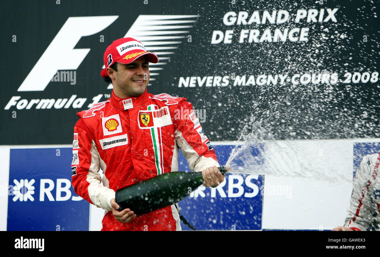 Ferrari's Felipe Massa celebrates his victory during the Grand Prix at Magny-Cours, Nevers, France. Stock Photo