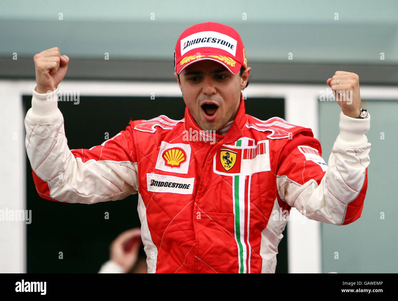 Ferrari's Felipe Massa celebrates his victory during the Grand Prix at Magny-Cours, Nevers, France. Stock Photo