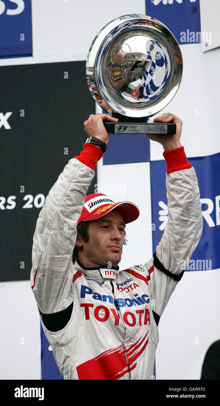 Toyota's Jarno Trulli celebrates his third place during the Grand Prix at Magny-Cours, Nevers, France. Stock Photo