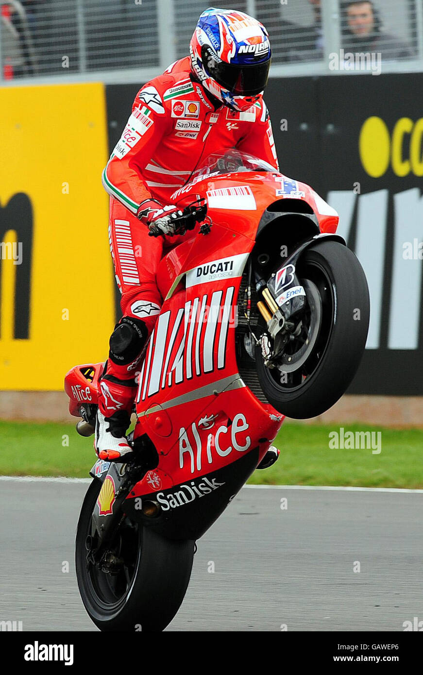 Ducati's Casey Stoner celebrates after winning the bwin.com British Motorcycle Grand Prix at Donington Park. Stock Photo