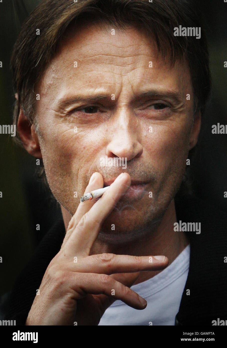 Robert Carlyle smokes a cigerette outside the Point Hotel in Edinburgh ahead of the world premier of his new film Summer, which is showing as part of the Edinburgh International Film festival. Stock Photo