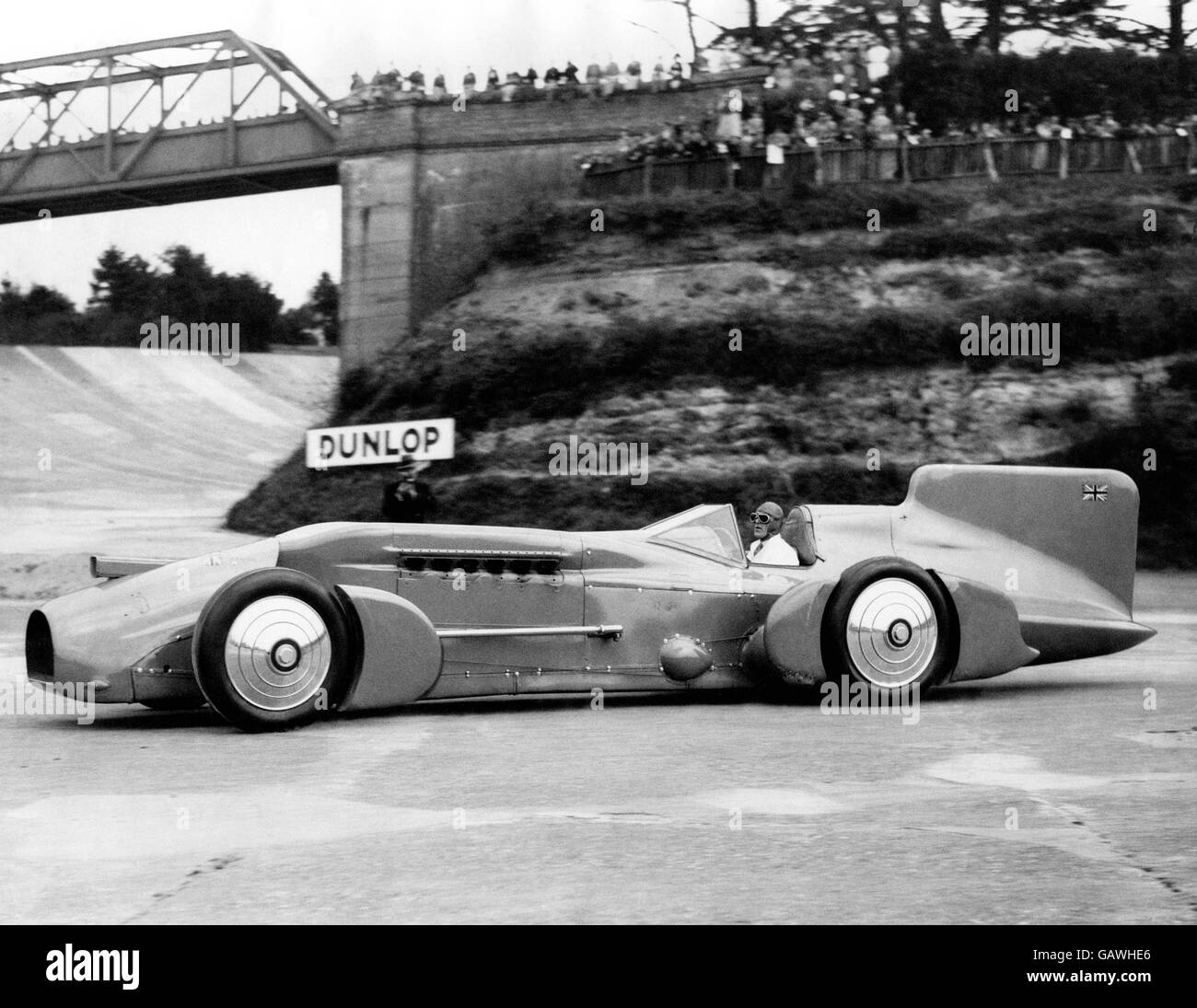 World land speed record holder Malcolm Campbell driving his record breaking Campbell-Railton Blue Bird around Brooklands. Stock Photo