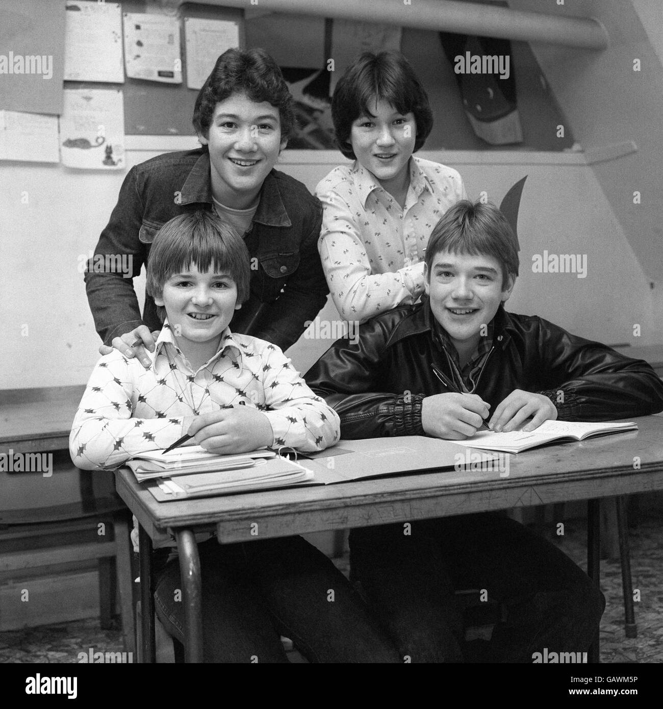 Members of the top teeny pop group 'Our Kid', ordered back to school by education authorities, in class at the Italia Conti School, London. From left: Kevin Rowan,13, Terry McCreith, 15, Terry Baccino, 16, and Brian Farrell. Stock Photo