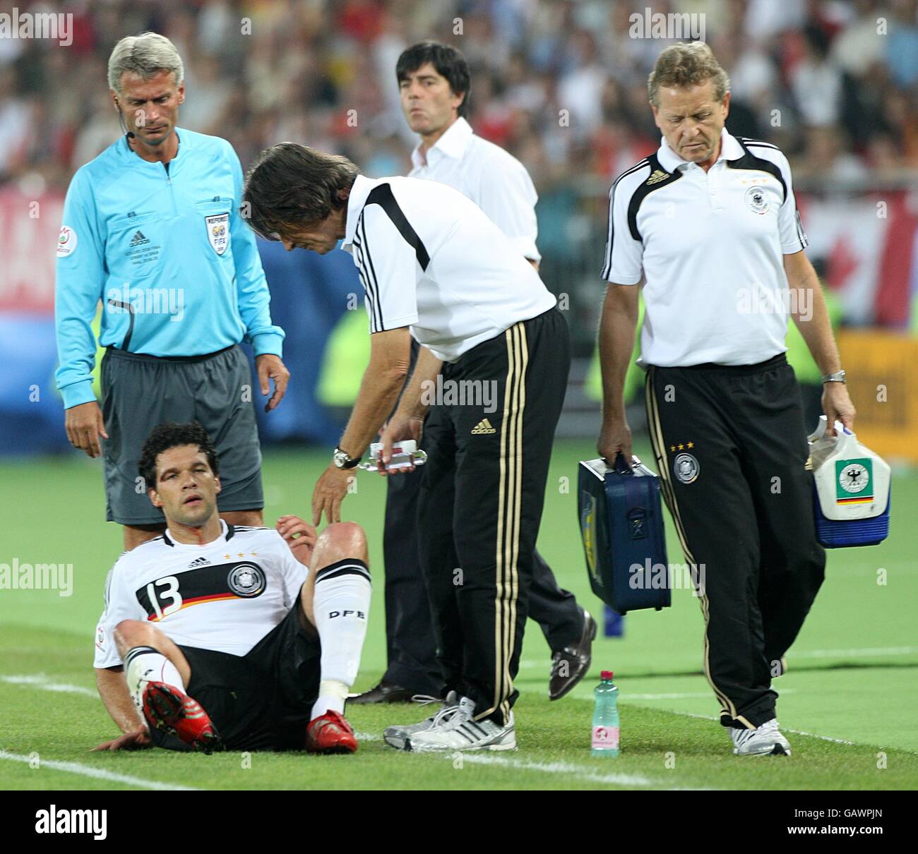 Germany's Michael Ballack receives treatment for a facial injury Stock ...