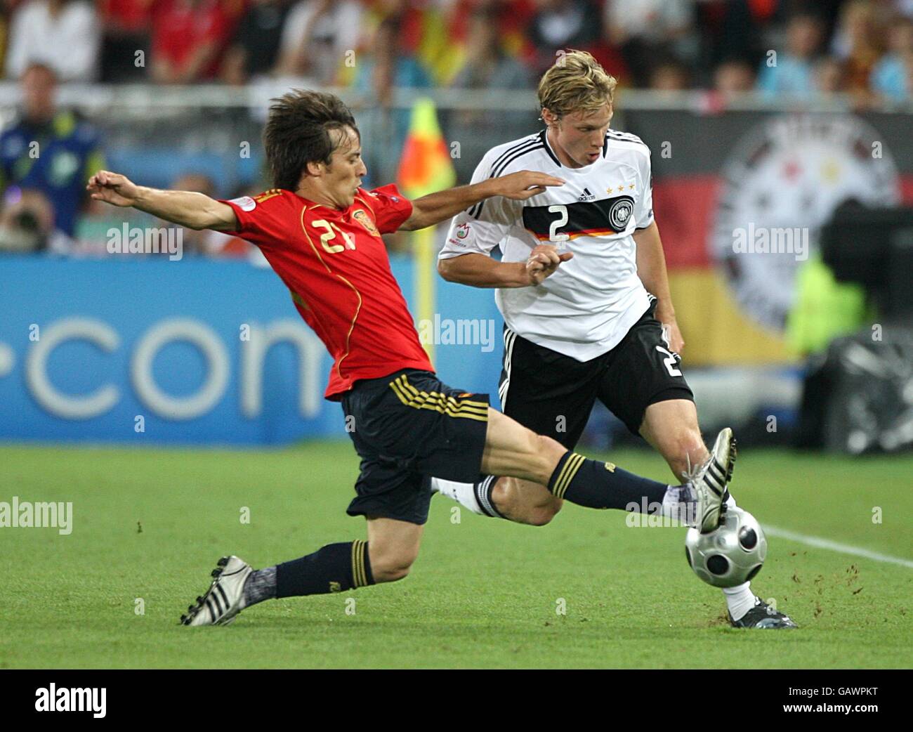 Spain's David Silva challenges Germany's Marcell Jansen for the ball Stock Photo