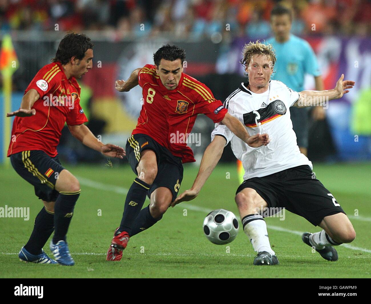Spain's Hernandez Xavi and Germany's Marcell Jansen in action Stock Photo