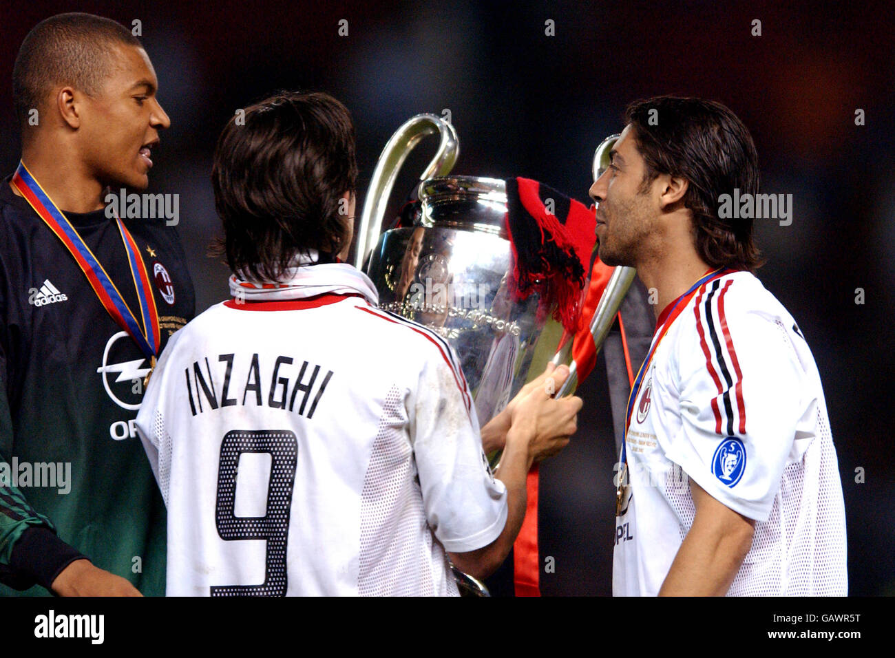 Soccer - UEFA Champions League - Final - Juventus v AC Milan. L-R: AC Milan's goalkeeper Dida, Filippo Inzaghi and Manuel Rui Costa celebrate with the trophy after the victory over Juventus Stock Photo