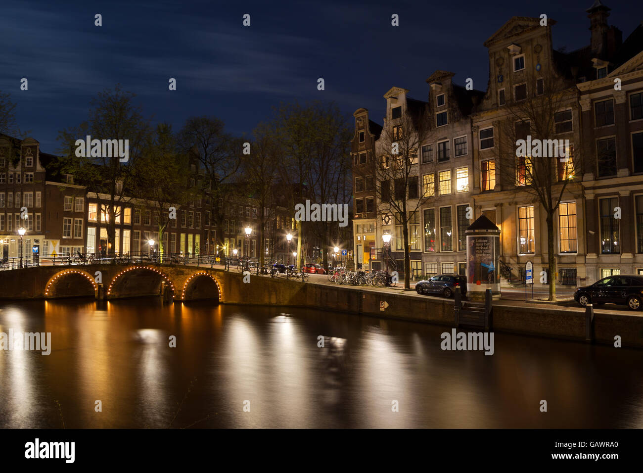 Night shot of the corner Herengracht and Leidsegracht in Amsterdam, Netherlands in spring. Stock Photo