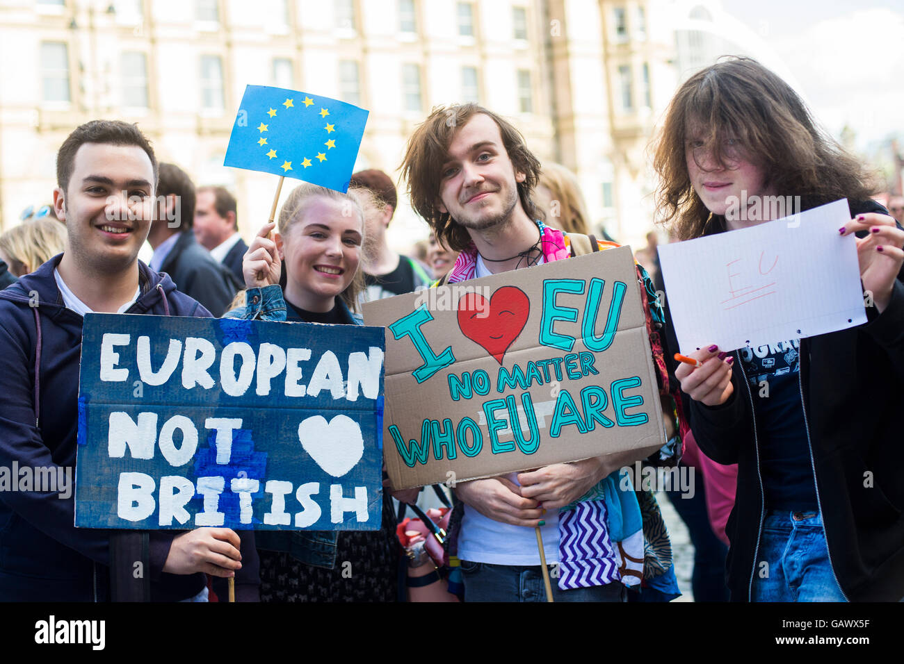 a group of teenagers protesting brexit holding pro EU signs/placards UK England Stock Photo