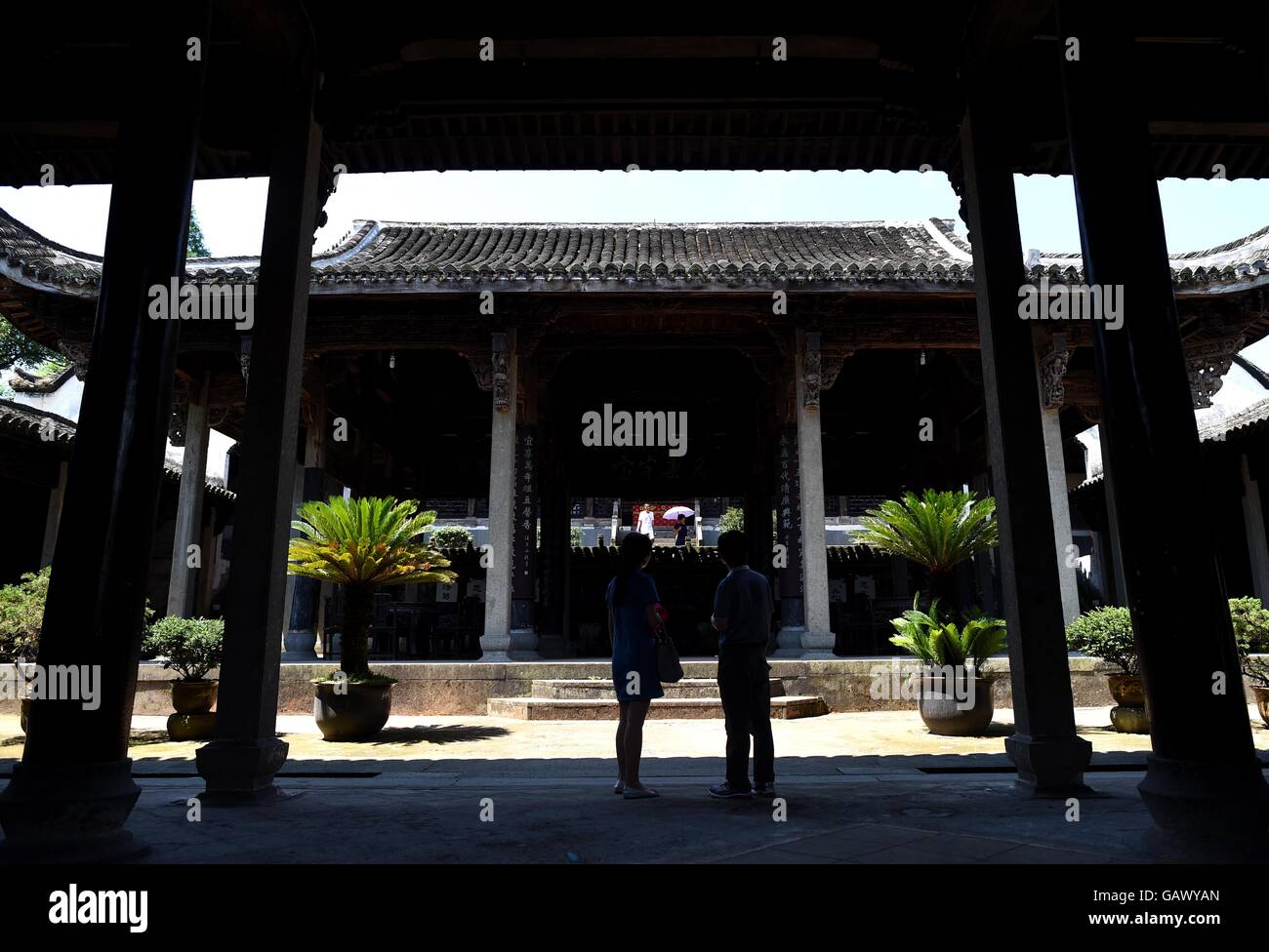 (160706) -- LANXI, July 6, 2016 (Xinhua) -- Tourists visit an ancestral hall in Zhuge Village in Lanxi City, east China's Zhejiang Province, July 5, 2016. The Zhuge Village, which has more than 660 years of history, is home to descendents of Zhuge Liang, an important military strategist and inventor serving as the Prime Minister of the Shu Kingdom in the period of the Three Kingdoms (220-265). The village was designed and constructed by Zhuge Dashi, 27th descendant of Zhuge Liang, following the design of the Bagua (Eight Diagrams) principles of Fengshui. (Xinhua/Han Chuanhao) (lfj) Stock Photo