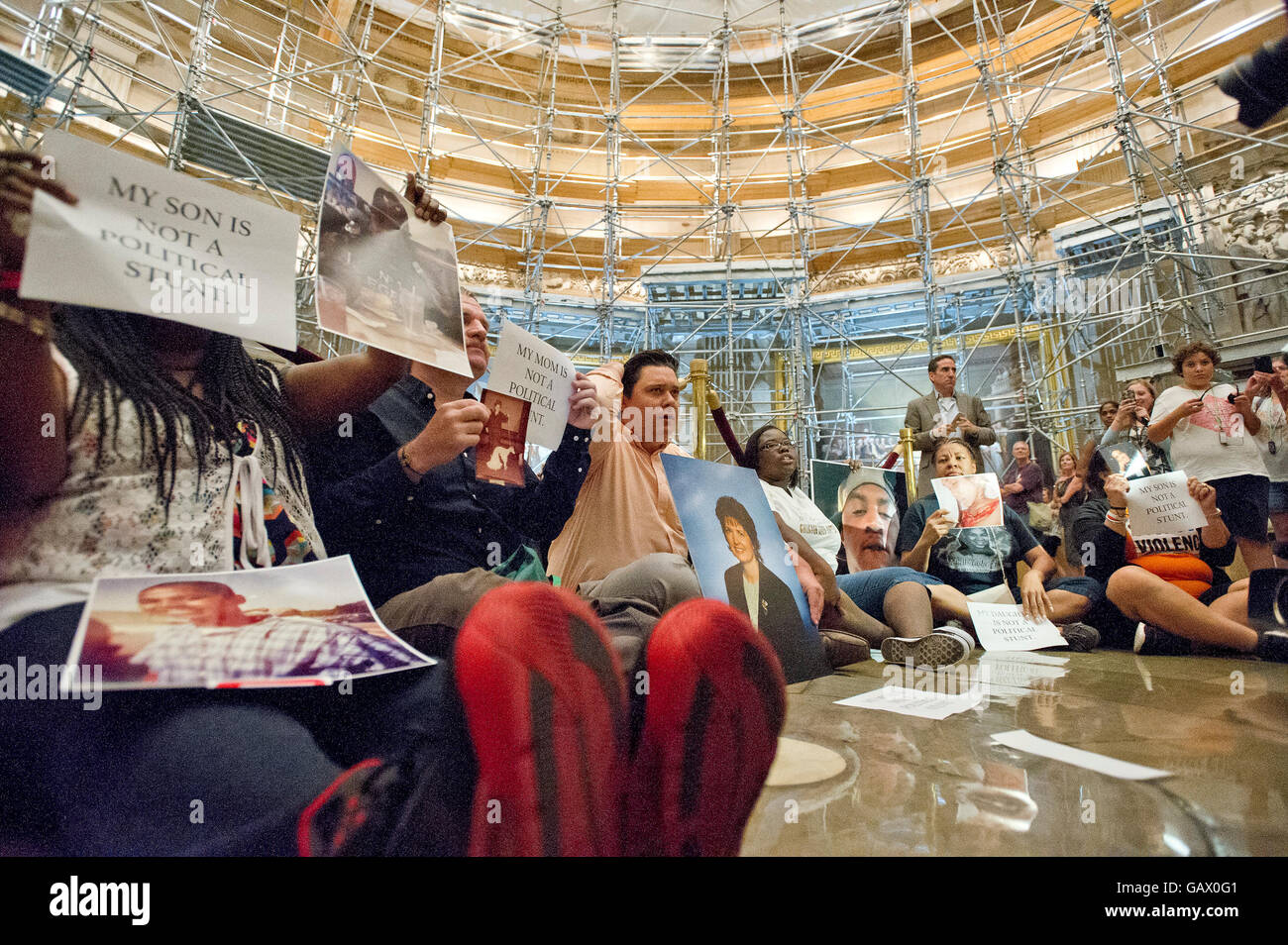 Washington, DC., USA. 5th July, 2016. Friends and family who have lost loved ones to gun violence stage a sit-in in the rotunda of the U.S. Capitol Building in Washington, DC as lawmakers return after the Fourth of July Recess on Tuesday, July 5, 2016. Protesters called on Congress to take real votes on common sense solutions to gun violence, including universal background checks, and an assault weapon and high-capacity magazine ban. Credit:  dpa picture alliance/Alamy Live News Stock Photo