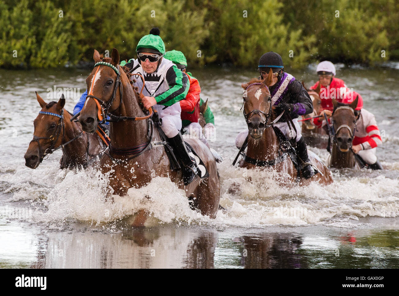 Hamburg, Germany. 5th July, 2016. Participants ride through a puddle ...