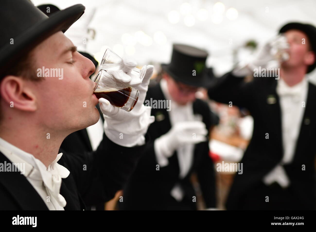 Bruchmeister Maximilian Bode-Meyer drinks a 'Luttje Lage', consisting of dark, top-fermented beer and corn schnapps, at the marksmen's festival Hannover in Hannover, Germany, 6 July 2016. It has been the custom since 1303 that the four special guards care for security in the city. Photo: Alexander Koerner/dpa Stock Photo