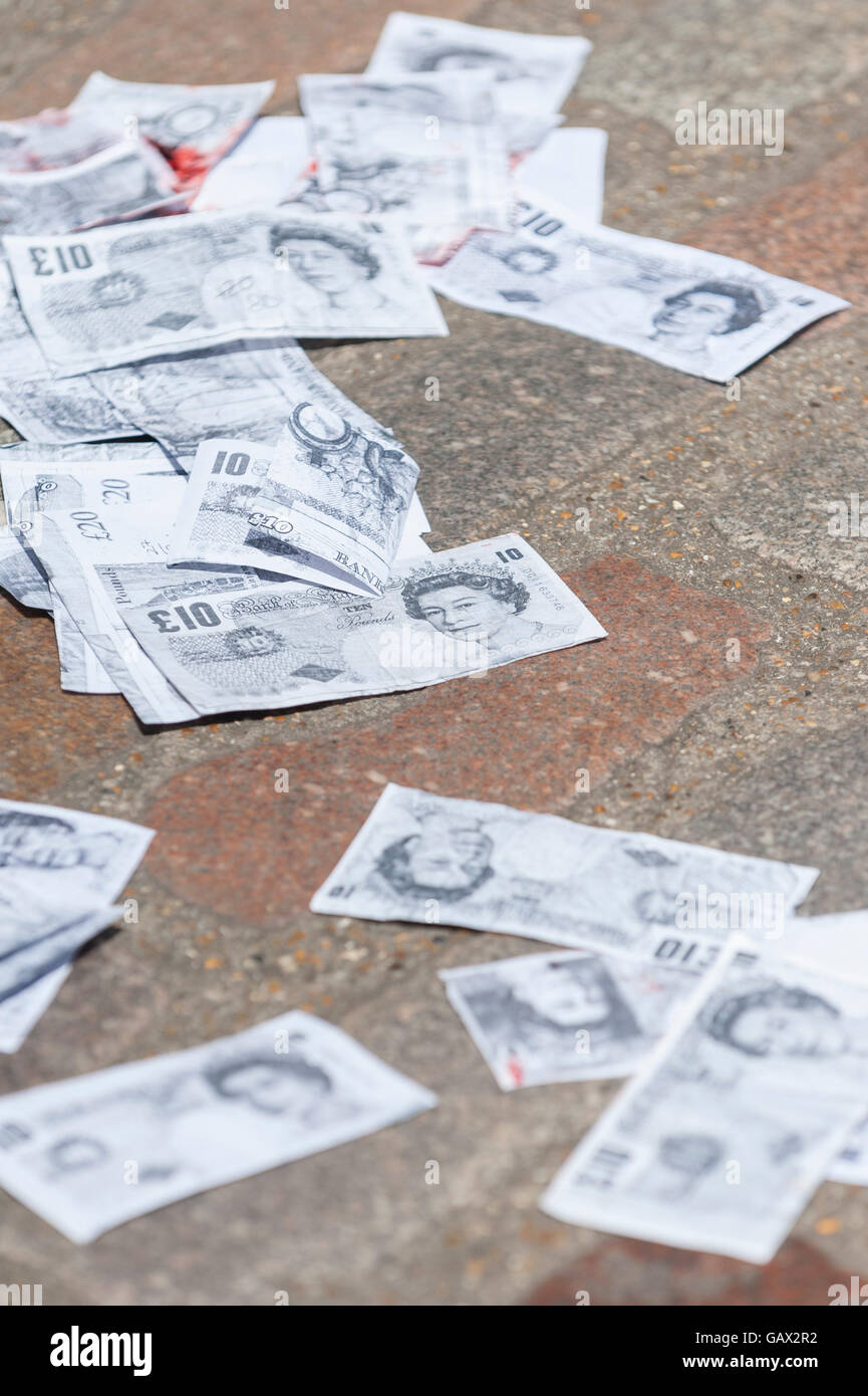 London !   Uk 6 July 2016 Fake Blood Money On The Ground As Stock - fake blood money on the ground as protesters from stop the war and campaign for nuclear disarmament gather outside queen elizabeth ii centre in westminster