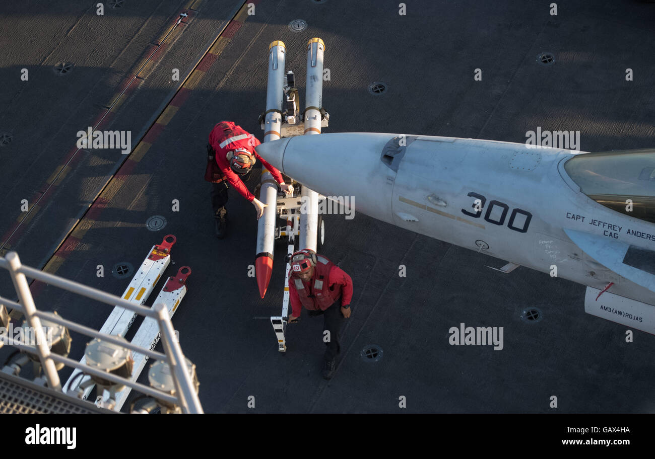 Aviation ordnancemen move missiles on the deck of the aircraft carrier USS Dwight D. Eisenhower in the eastern Mediterranean Sea, 01 July 2016. The images were taken upon invitation by the U.S. Navy. Photo: Marijan Murat/dpa Stock Photo