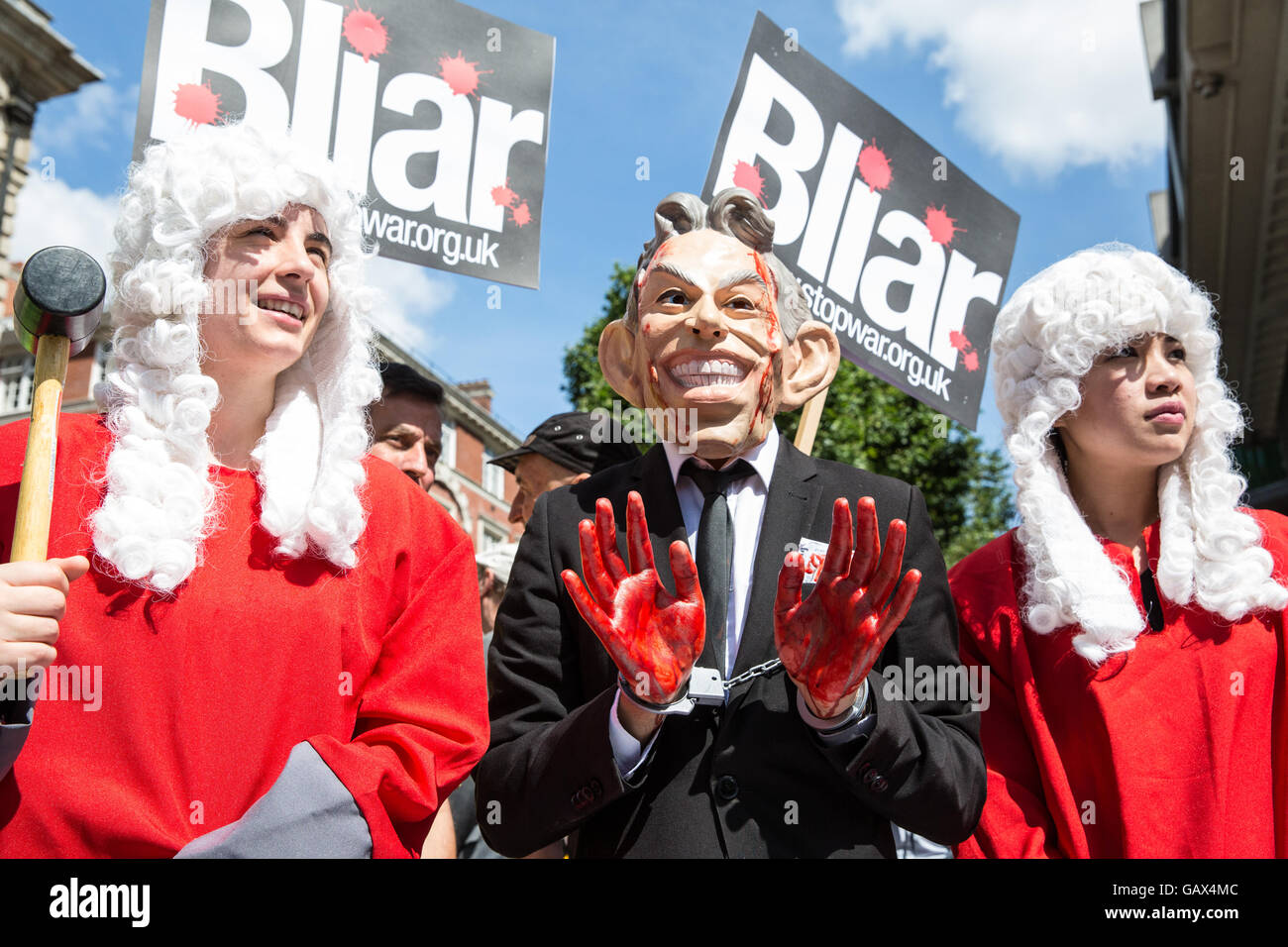 London, UK. 6th July, 2016. A protester wearing a Tony Blair mask and with bloodied hands waits for the publication of the Chilcot Report outside the Queen Elizabeth II Centre. The protest was organised by Stop The War Coalition. Credit:  Mark Kerrison/Alamy Live News Stock Photo