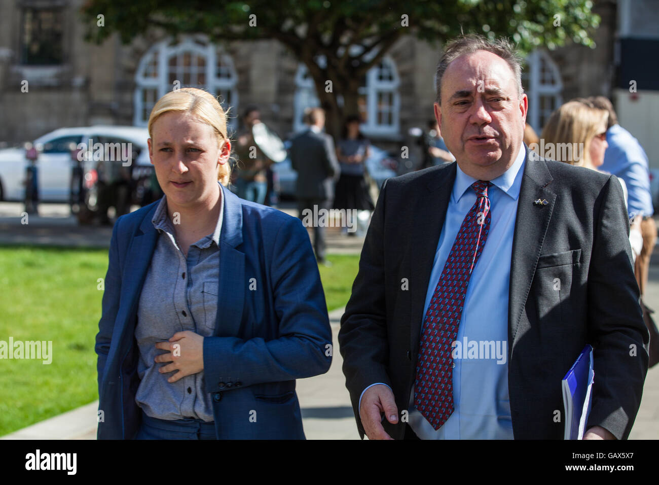 London, UK. 6th July, 2016. Mhairi Black, SNP MP for Paisley and Renfrewshire South, and Alex Salmond, SNP MP for Gordon, outside Parliament on the day of publication of the Chilcot Report. Alex Salmond had just called for legal action to be taken against former Prime Minister Tony Blair. Credit:  Mark Kerrison/Alamy Live News Stock Photo