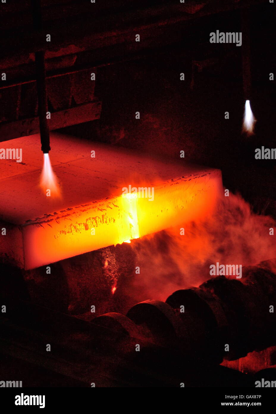 Gas cutting of the hot metal in steel plant Stock Photo