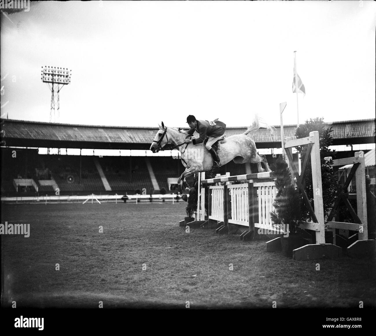 Pierre d'Oriola, riding Voulette, clears another fence during a perfect round which won him the Tally Ho Stakes Stock Photo