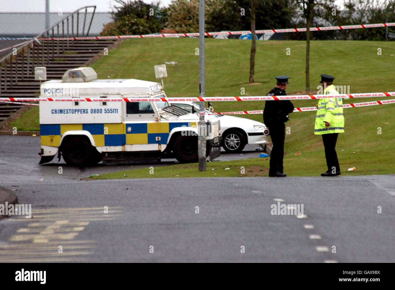 Police Service of Northern Ireland officers close to the scene in Londonderry's Creggan Estate where a man was shot dead early on Tuesday. Emmett Shiels, 22, from Tyrconnell Street in the Bogside, was shot in the Bligh's Lane area. Stock Photo