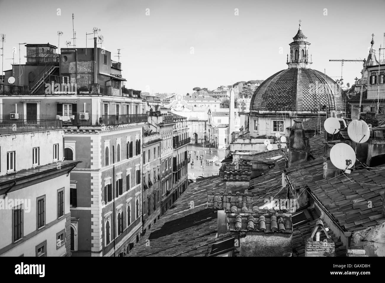 Old Rome, Italy. Via del Corso street view, black and white photo taken from the roof, looking on The Piazza del Popolo with dom Stock Photo