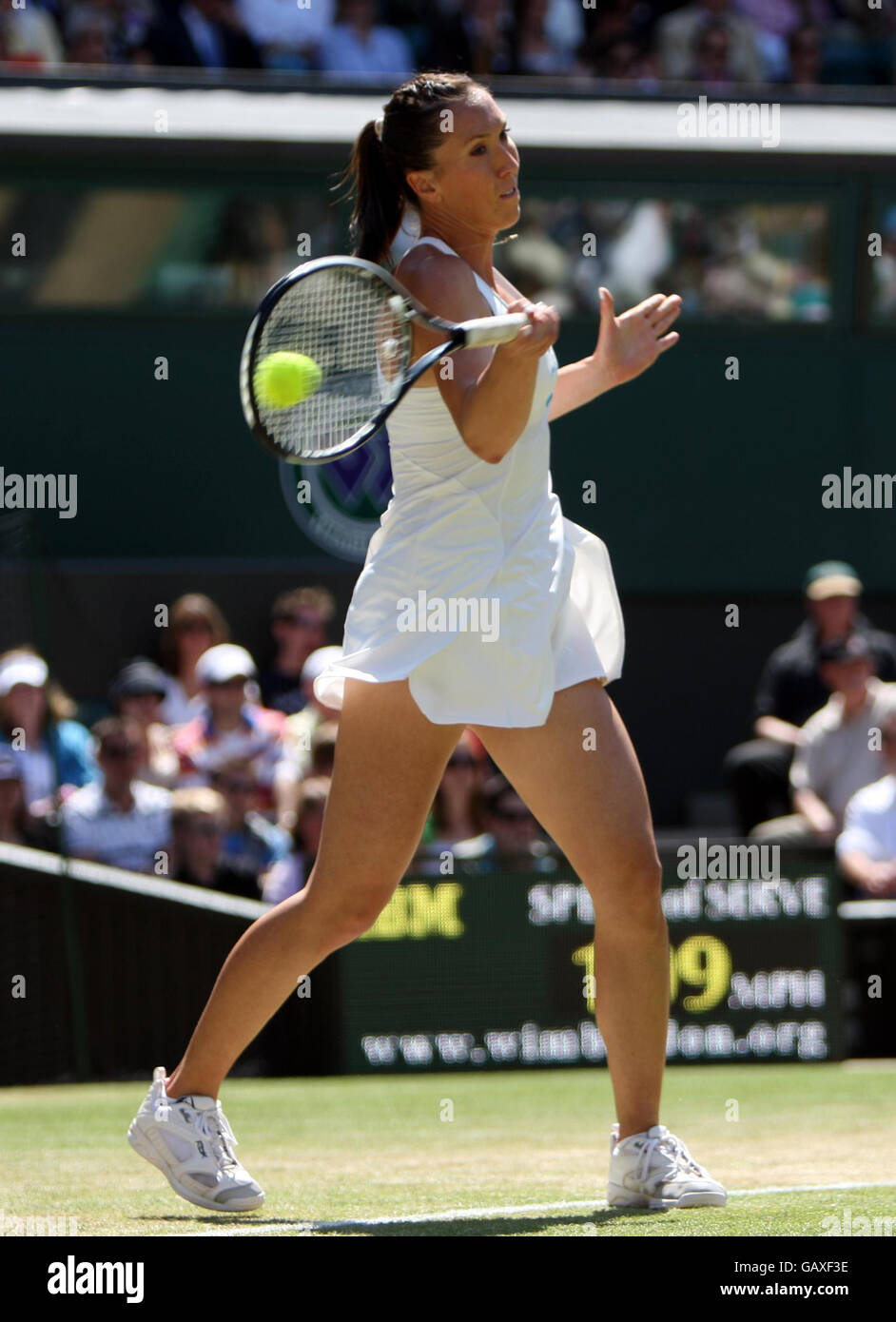 Serbia's Jelena Jankovic in action against Denmark's Caroline Wozniacki during the Wimbledon Championships 2008 at the All England Tennis Club in Wimbledon. Stock Photo