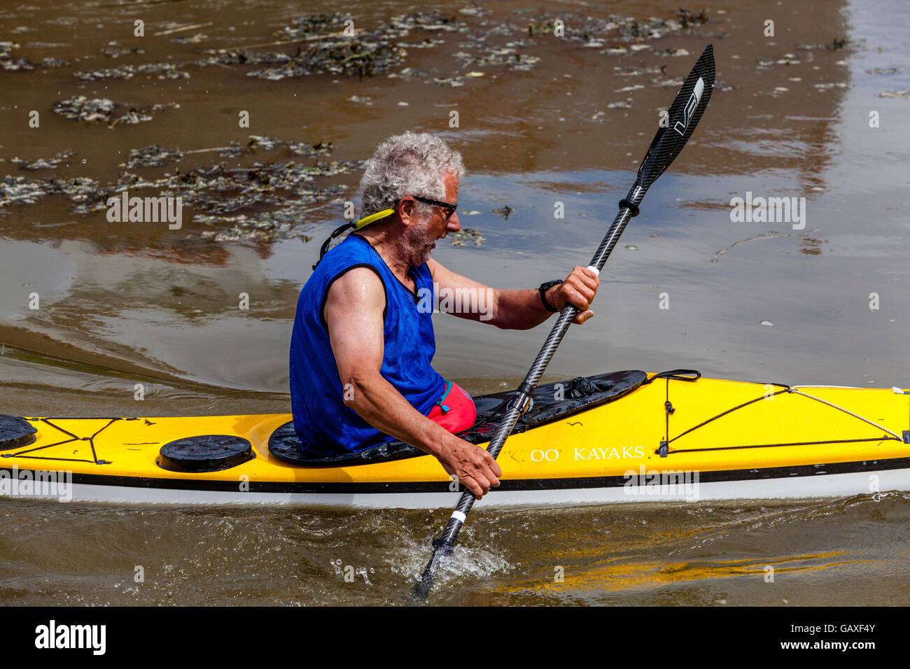 An Elderly Man Kayaking On The River Ouse, Lewes, Sussex, UK Stock Photo