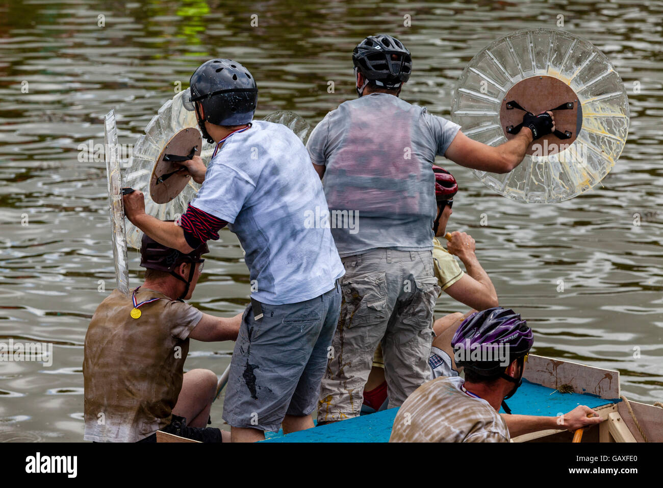 A Raft Crew Protect Themselves With Shields From People Throwing Eggs ...
