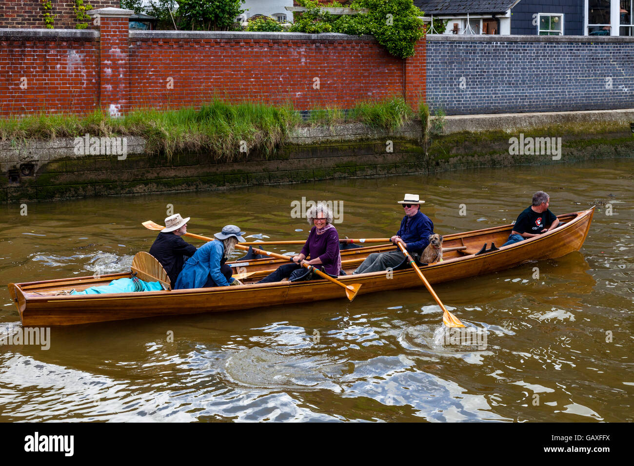 A Group Of People In A Rowing Boat On The River Ouse, Lewes, Sussex, UK