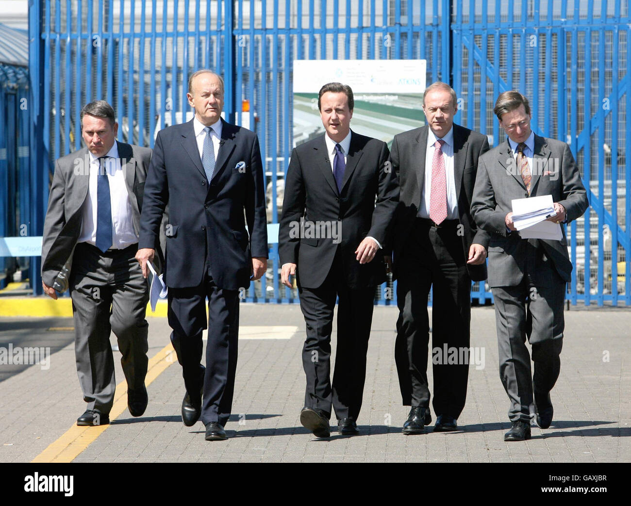 Conservative Party's leader David Cameron, Shadow Home Secretary Dominic Grieve (right), Shadow Immigration Minister Damien Green (second right), Lord Stevens and Colonel Richard Kemp (left) arrive for a press conference to launch Lord Stevens' report 'Border Protection Service for the UK: Policy Proposals' at London City Airport. Stock Photo