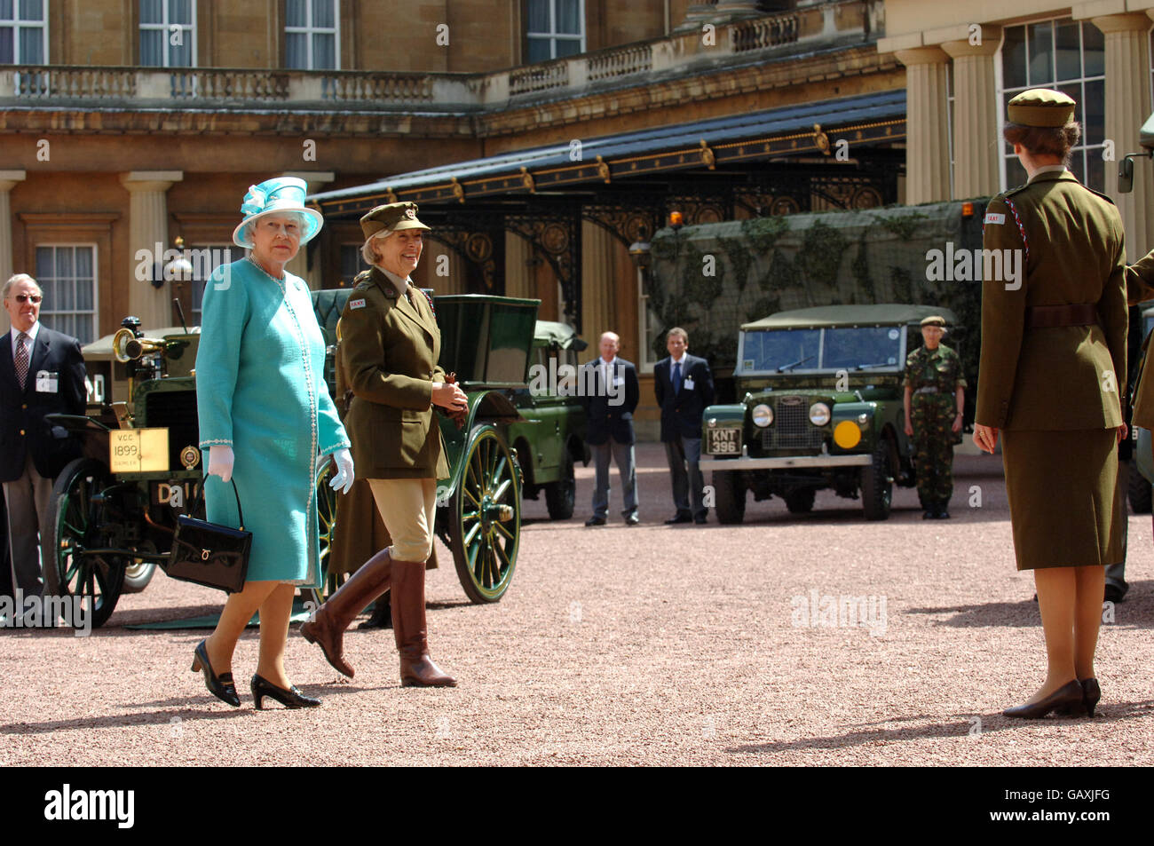 Britain's Queen Elizabeth II, inspects vintage vehicles used by the First Aid Nursing Yeomanry during WWII, which were assembled in the quadrangle of Buckingham Palace, London. Stock Photo