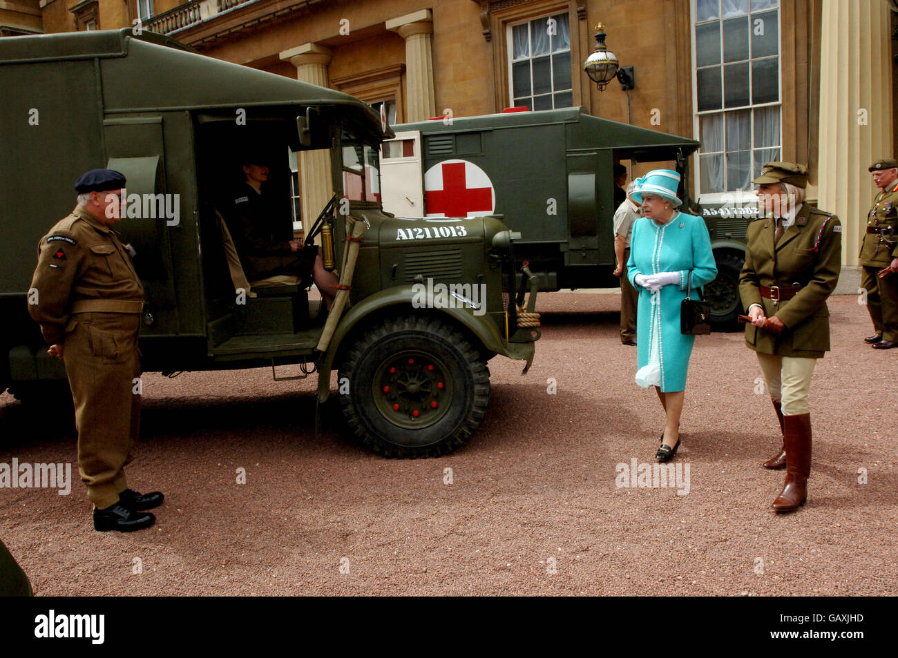 Britain's Queen Elizabeth II, inspects vintage vehicles used by the First Aid Nursing Yeomanry during WWII, which were assembled in the quadrangle of Buckingham Palace, London. Stock Photo