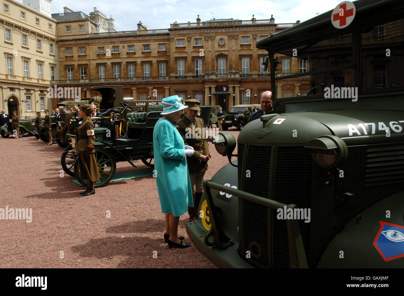 Britain's Queen Elizabeth II, inspects vintage vehicles used by the First Aid Nursing Yeomanry during WWII, which were assembled in the quadrangle of Buckingham Palace, London. Stock Photo