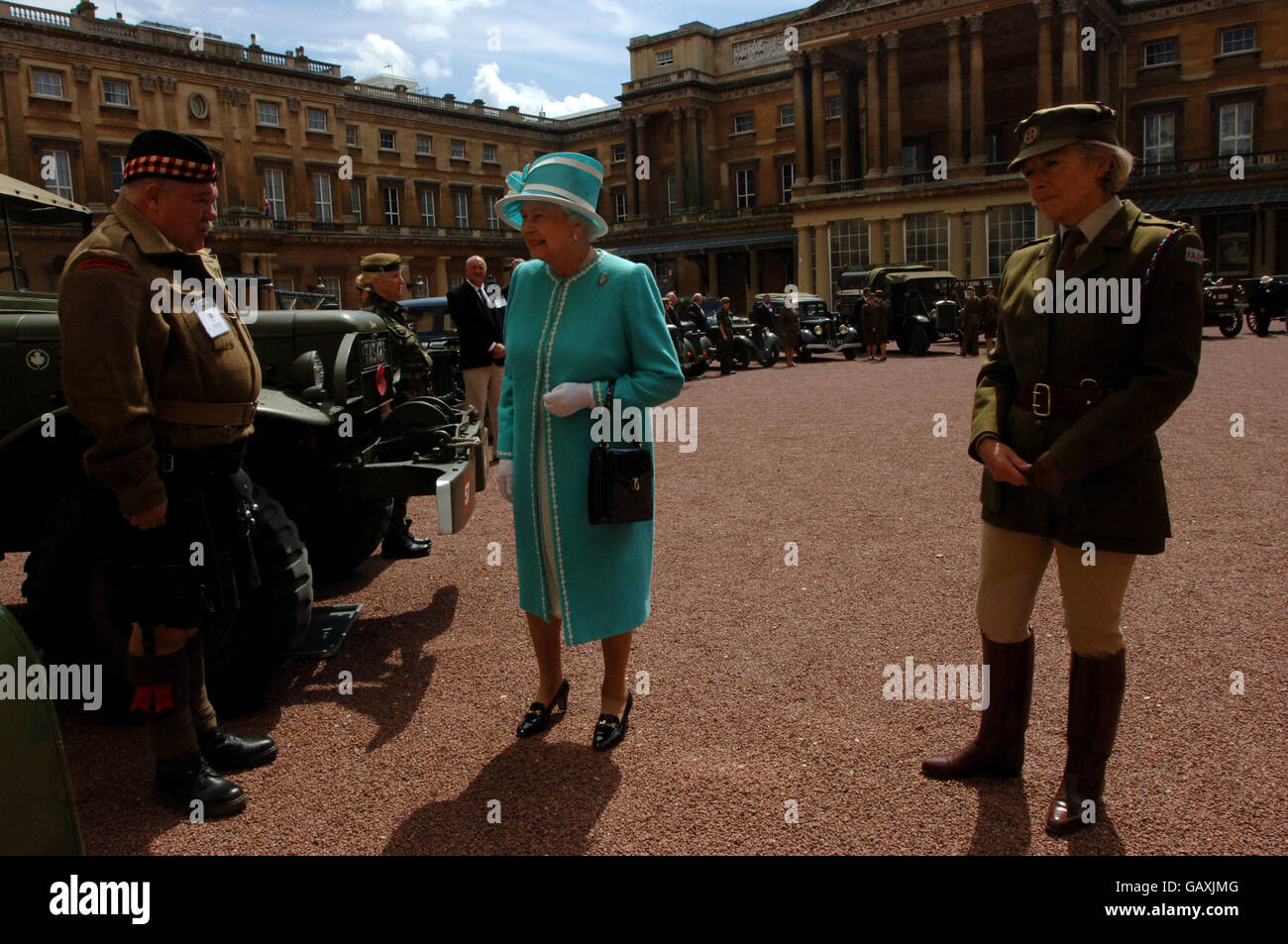 Britain's Queen Elizabeth II, inspects vintage vehicles used by the First Aid Nursing Yeomanry during WWII, which were assembled in the quadrangle of Buckingham Palace, London. Stock Photo