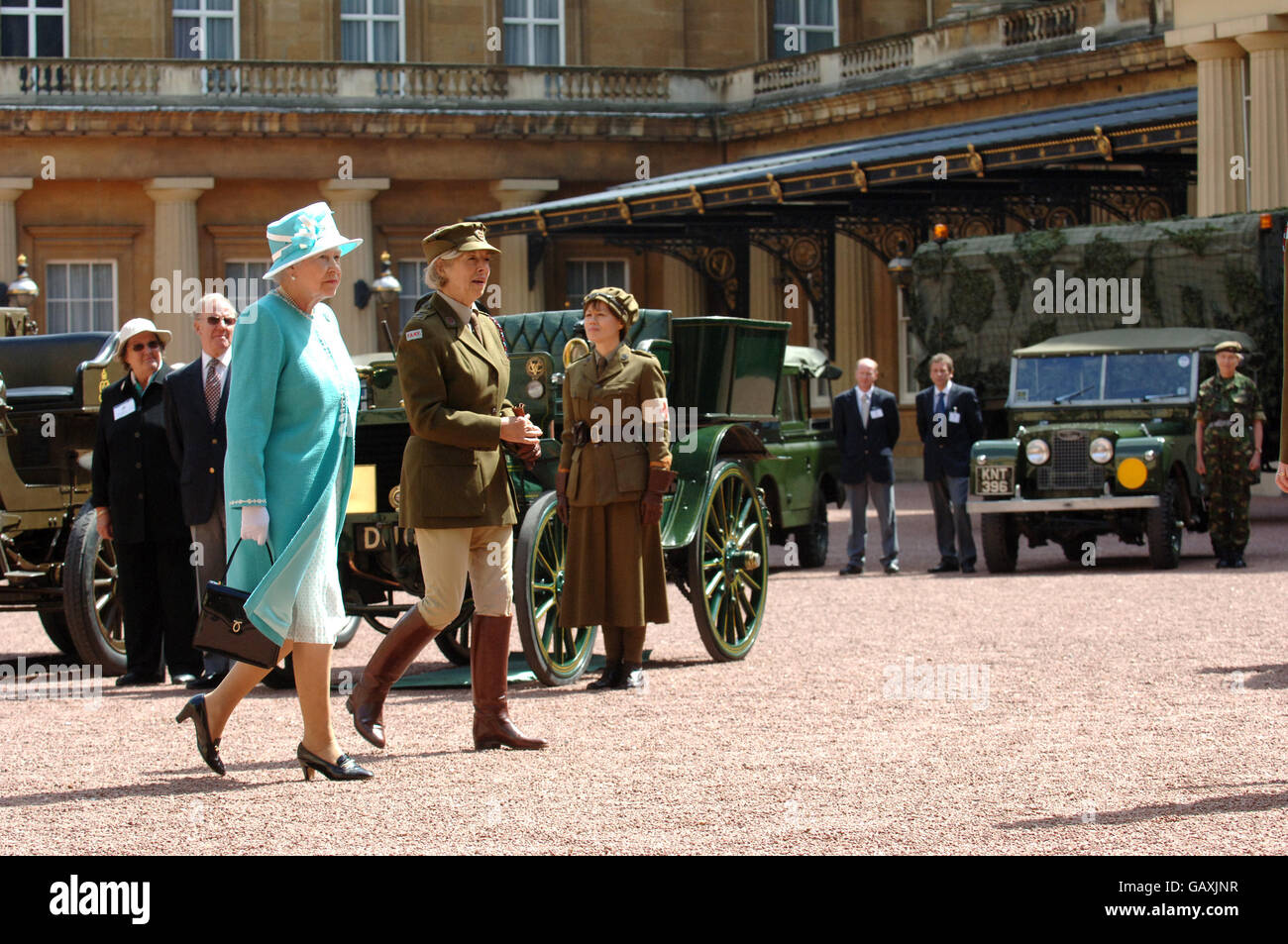 Britain's Queen Elizabeth II, inspects vintage vehicles used by the First Aid Nursing Yeomanry during WWII, which were assembled in the quadrangle of Buckingham Palace, London. Stock Photo