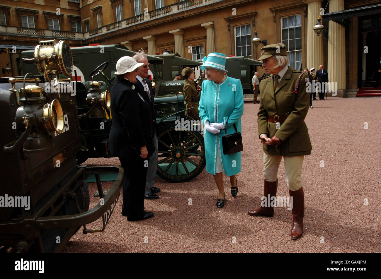 Britain's Queen Elizabeth II, inspects vintage vehicles used by the First Aid Nursing Yeomanry during WWII, which were assembled in the quadrangle of Buckingham Palace, London. Stock Photo