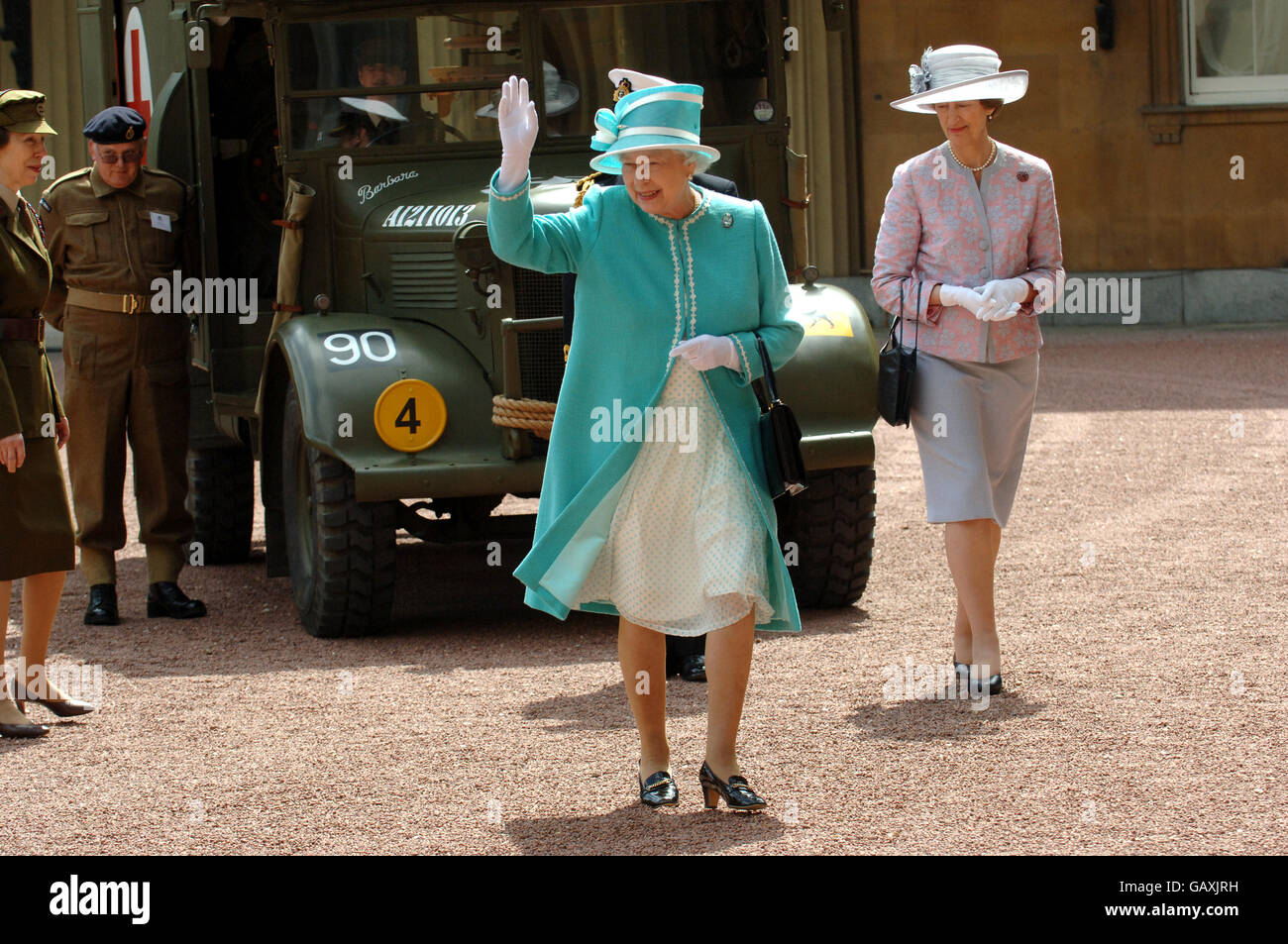 Britain's Queen Elizabeth II, inspects vintage vehicles used by the First Aid Nursing Yeomanry during WWII, which were assembled in the quadrangle of Buckingham Palace, London. Stock Photo