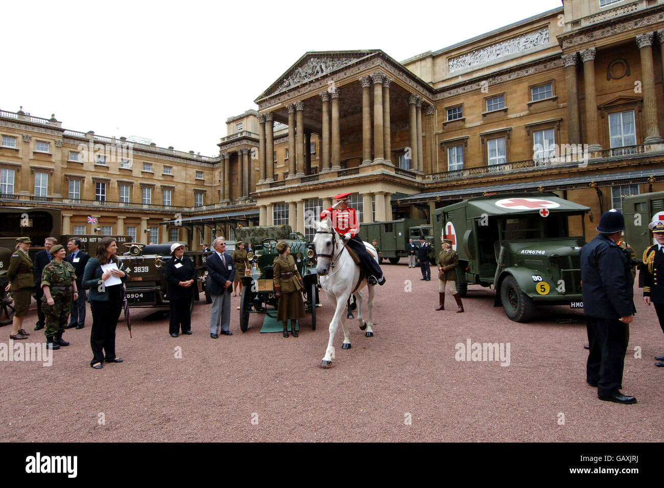Vintage vehicles used by the First Aid Nursing Yeomanry during WWII, which were assembled in the quadrangle of Buckingham Palace, London. Stock Photo